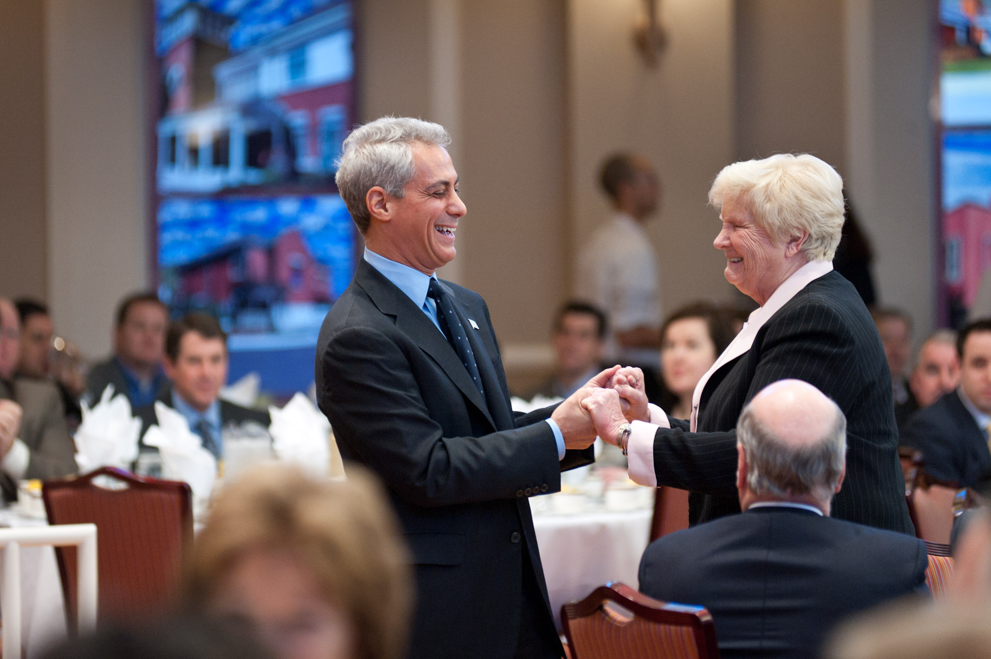 Mayor Emanuel at a dinner with many people around the room at tables at Misercordia